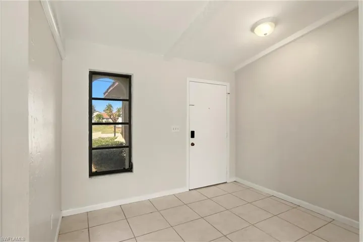 Spare room with light tile patterned floors
