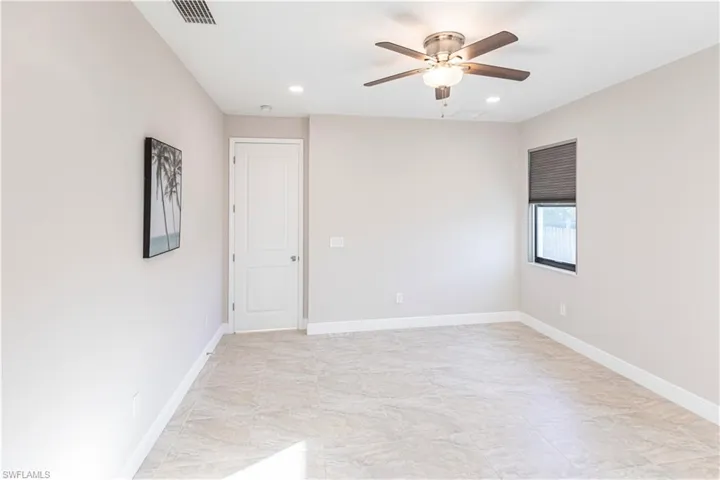 Empty room featuring ceiling fan