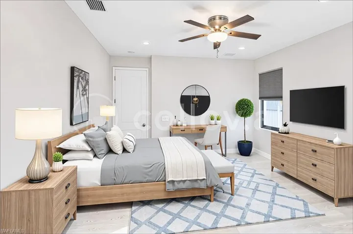 *virtual staging* Bedroom with ceiling fan and light hardwood / wood-style floors