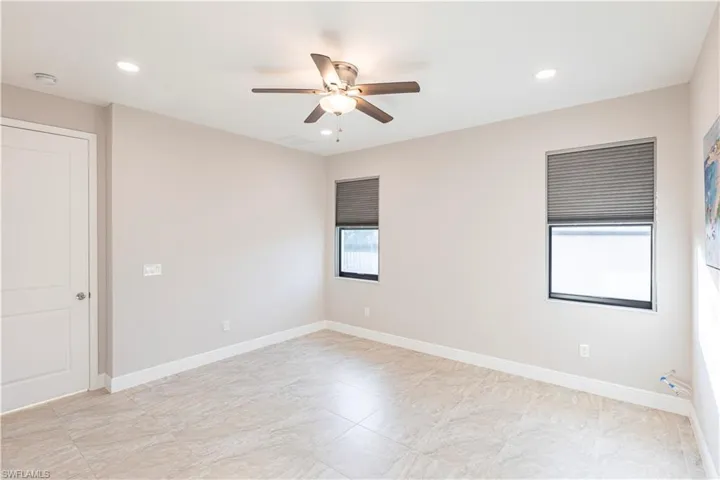 Spare room with ceiling fan