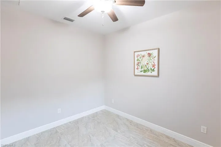 Unfurnished room featuring ceiling fan