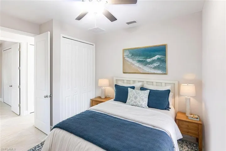 Bedroom featuring ceiling fan and a closet