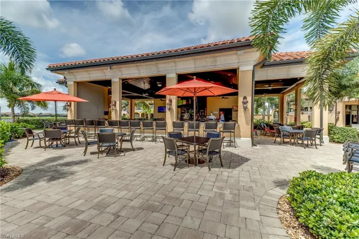 View of Tiki Bar featuring a ceiling fan and outdoor dining area