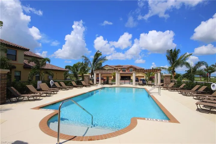 Pool with a patio, fence, and a pergola