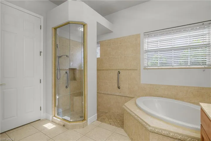 Master bathroom walk-in shower and soaking tub