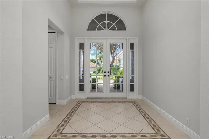 Entire interior repainted September 2025. Elegant front door entry. Hall to left leads to 2 guest bedrooms and a full bath.