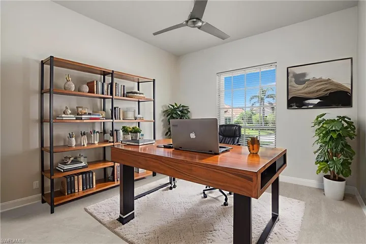 Den with staged furniture, new carpet and new fan
