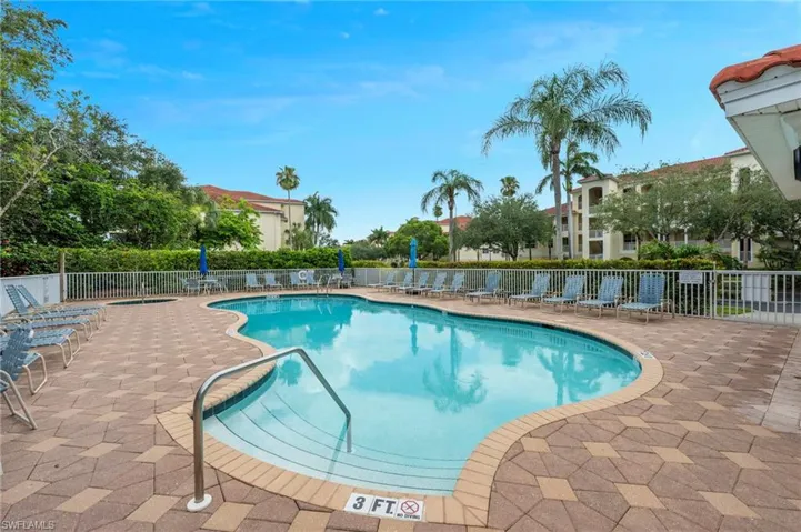 Community pool featuring a patio