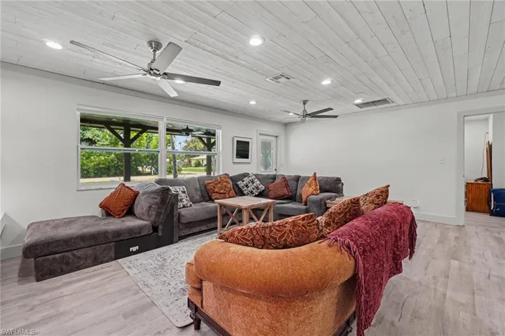 Main House - A gorgeous coastal plank wood ceiling crowns the great room, enhancing its relaxed, beach-inspired charm.