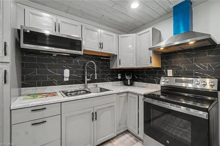Main House - chef-inspired kitchen is outfitted with high-end stainless steel appliances, creating a sophisticated space that's as beautiful as it is practical.