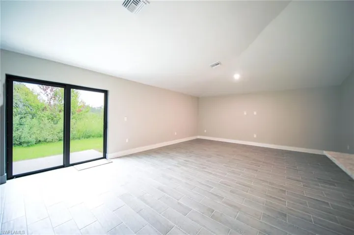 Dual Hurricane Sliders That Lead Out To An Open Lanai From The Oversized Living Room!