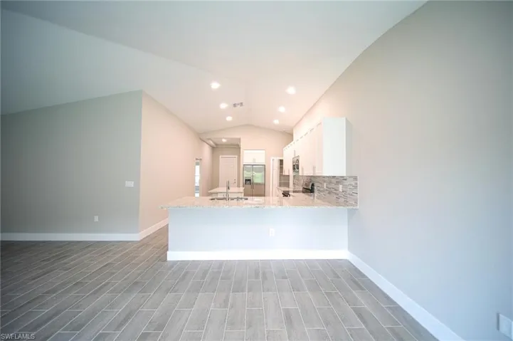 Extremely Large Dining Area With A View Next To The Kitchen Island That Also Seats 3 People!
