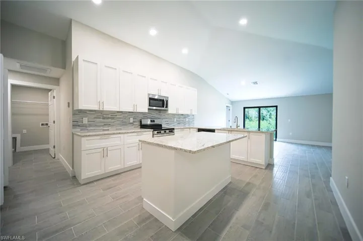 The Island Kitchen Comes With Granite Countertops, Soft Closing Real Wood Shaker Cabinets & Drawers, Tile Backsplash, Brand New Stainless Steel Appliances, Breakfast Bar That Seats Three, And A Huge Walk-In Pantry!