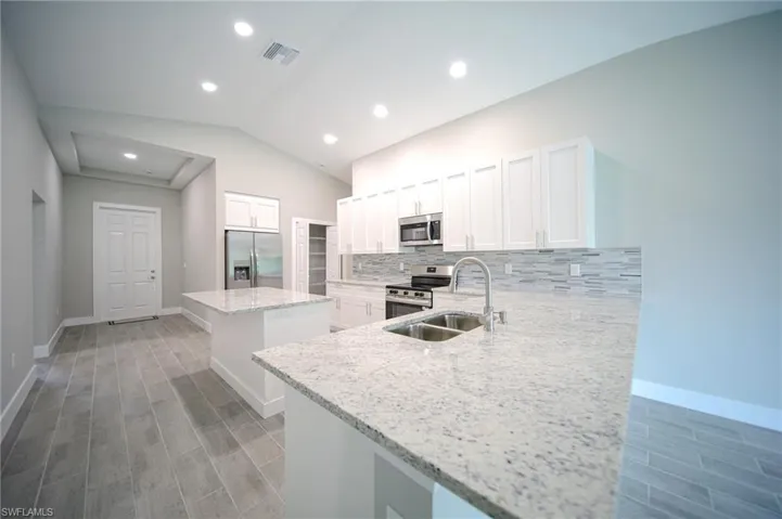 The Island Kitchen Comes With Granite Countertops, Soft Closing Real Wood Shaker Cabinets & Drawers, Tile Backsplash, Brand New Stainless Steel Appliances, Breakfast Bar That Seats Three, And A Huge Walk-In Pantry!
