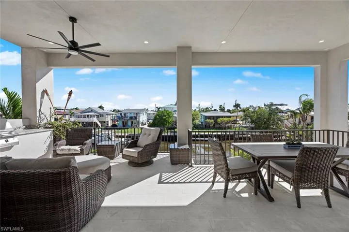 View of patio featuring an outdoor living space and ceiling fan