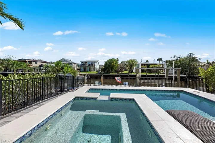 View of pool featuring an in ground hot tub