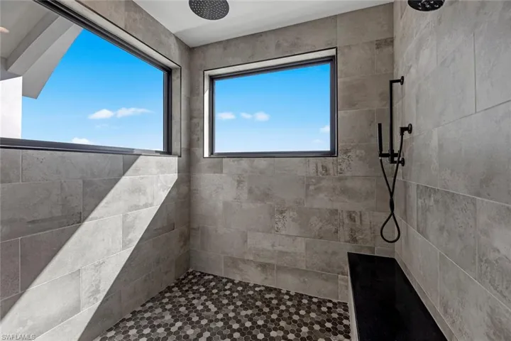 Bathroom featuring tiled shower