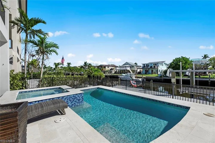 View of pool featuring an in ground hot tub