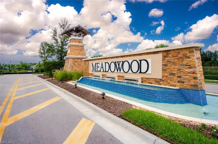 View of property's community with a yard and a playground