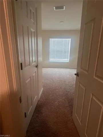 Doorway with hardwood / wood-style floors