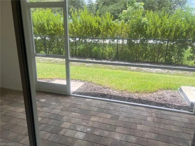 View of play area with a lawn