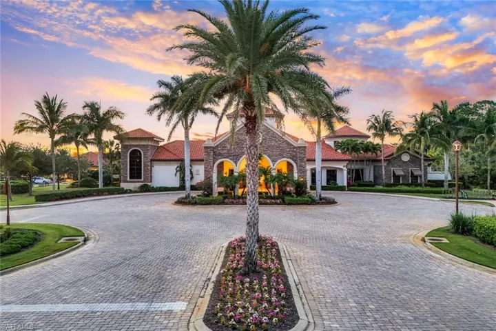 The Club at dusk with curved driveway