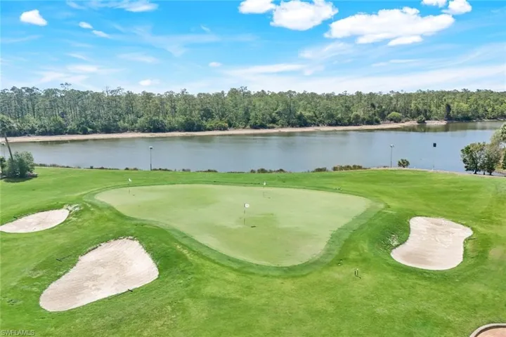 View of home's community featuring view of golf course and a water view