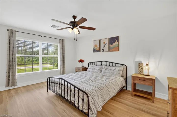 Bedroom featuring light wood-type flooring and ceiling fan