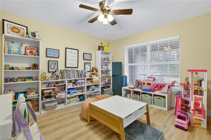 Game room featuring wood finished floors and a ceiling fan