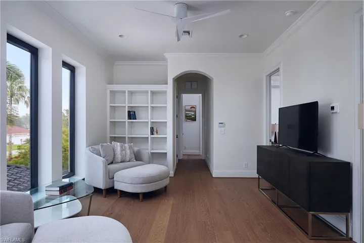 Upstairs living room/ shared space with secondary laundry room adjacent