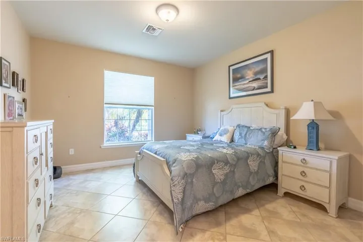 Bedroom featuring light tile patterned flooring