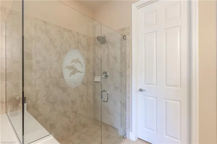 Bathroom featuring a shower with shower door