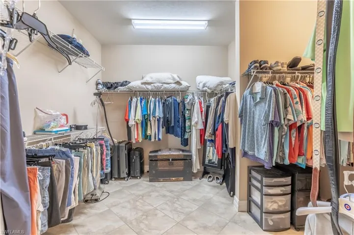 Walk in closet featuring light tile patterned floors