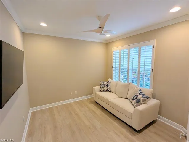Living area featuring light wood-style flooring, ornamental molding, recessed lighting, and ceiling fan