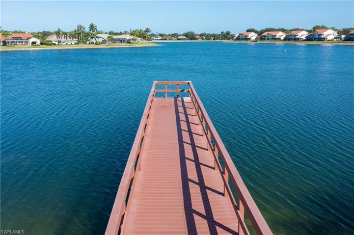 Dock with a water view and a residential view
