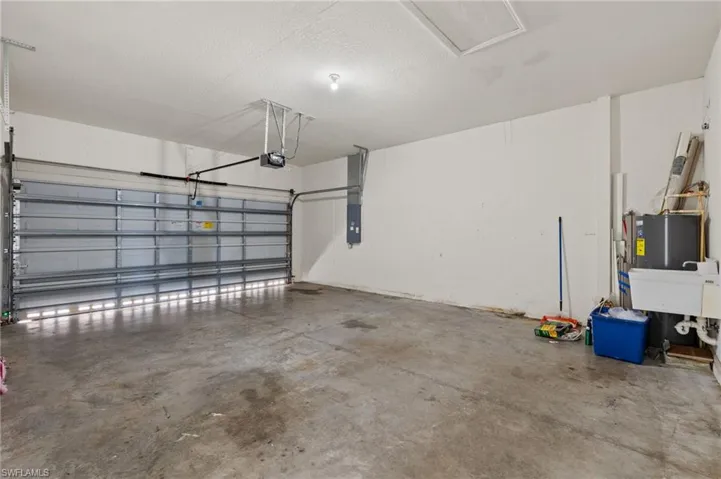 Garage with a garage door opener and electric panel