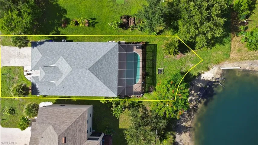 View from above of property featuring property boundaries highlighted and a nearby body of water