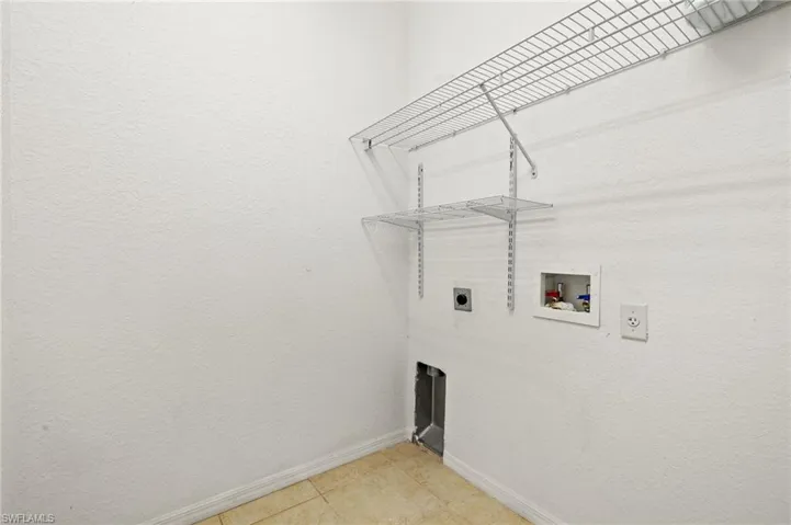 Laundry room with hookup for an electric dryer and hookup for a washing machine