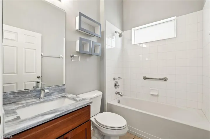 Full bathroom featuring vanity and shower / tub combination