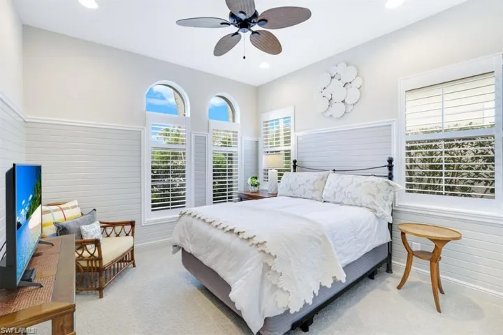 Bedroom with multiple windows, carpet, a ceiling fan, and recessed lighting