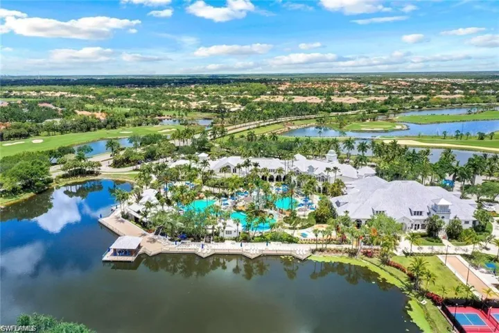 View of property location featuring a large body of water and a golf club