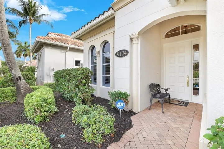 Doorway to property with stucco siding