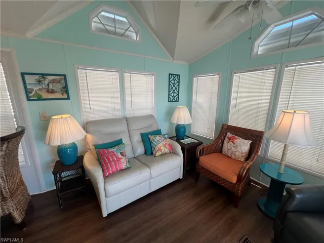 Living Room with Vaulted Ceiling, Laminate Flooring and Ceiling Fan
