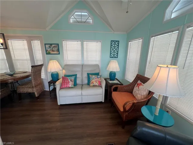 Living Room with Vaulted Ceiling, Laminate Flooring and Ceiling Fan