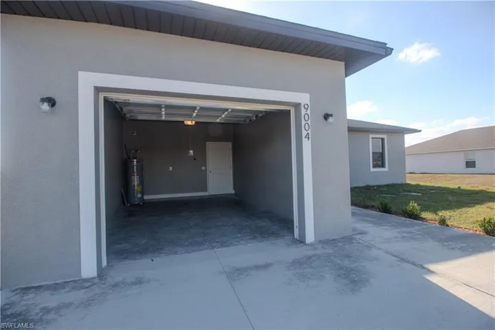 View of garage with water heater