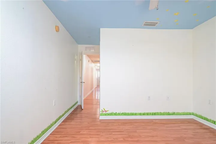 Unfurnished room featuring light wood-type flooring
