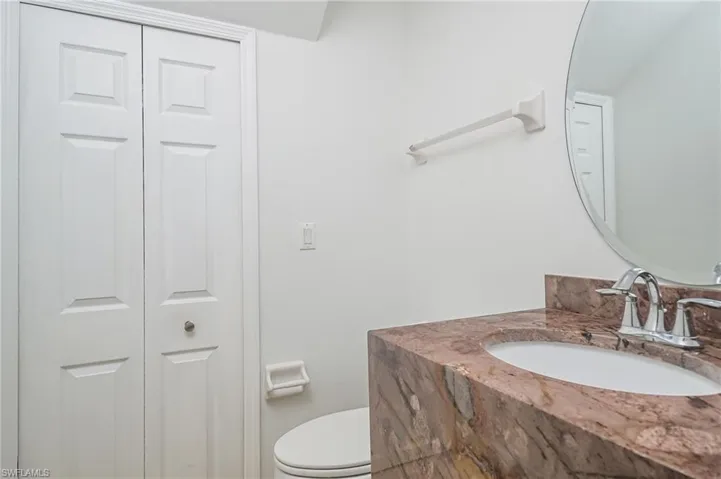 Bathroom featuring vanity and toilet