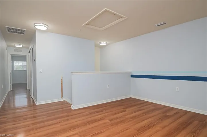 Unfurnished room with wood-type flooring