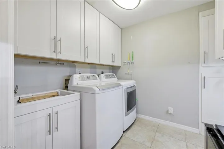 Laundry with tub and lots of storage