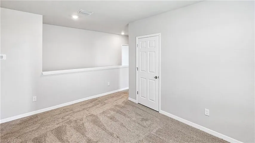 Spare room with carpet floors